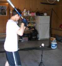  He loves to hit in our garage  