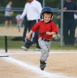 A happy t ball runner