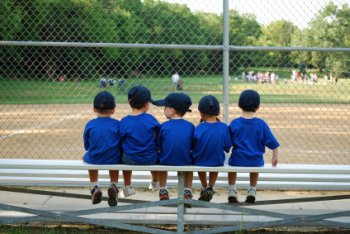 Players waiting for their kids t ball game to start